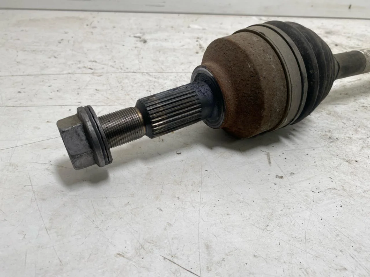 Tesla MODEL 3 2024- Front left driveshaft view 2