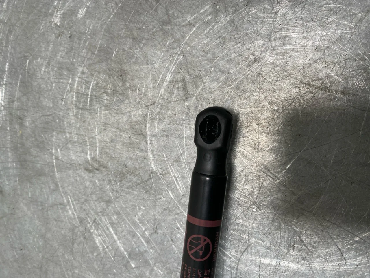 Hood gas strut view 3